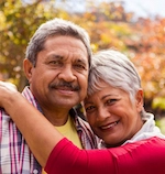 Elderly women hugging husband after a consultation with an injury lawyer.